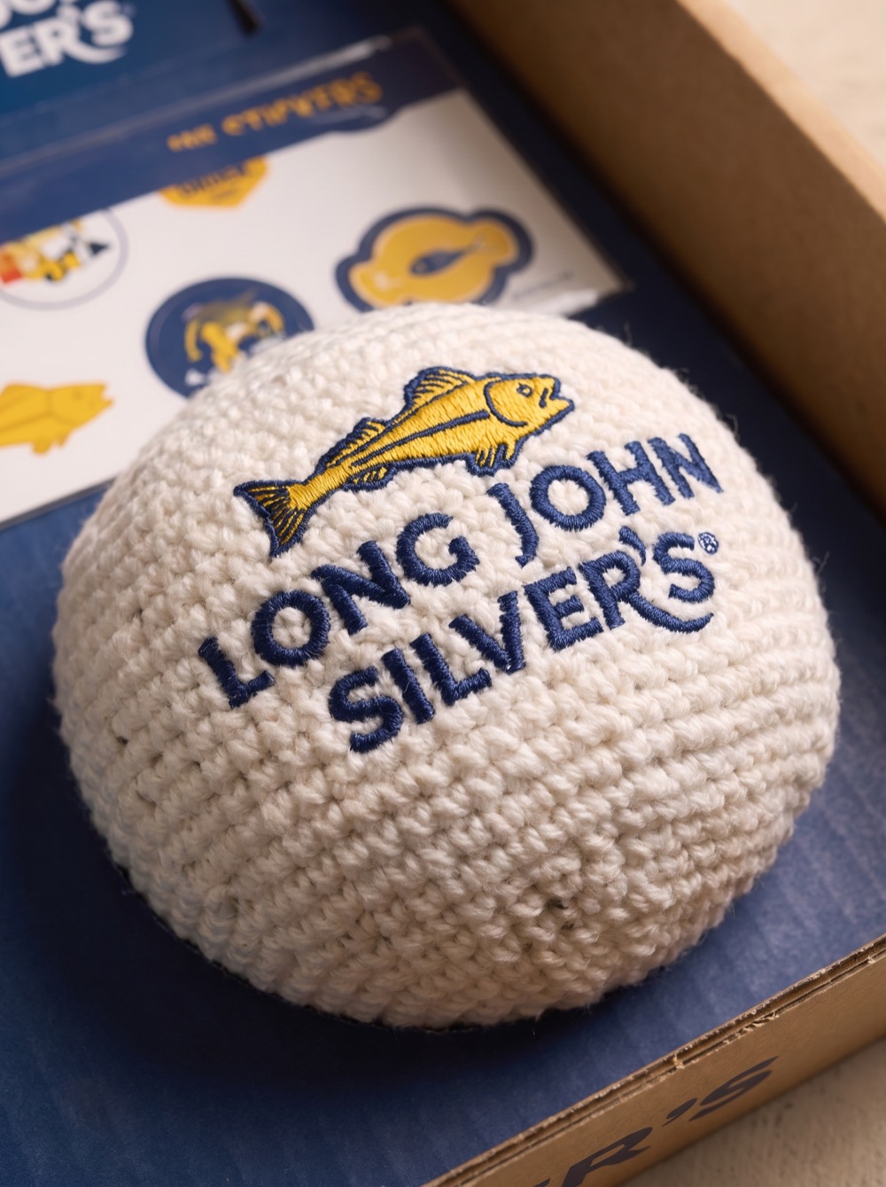 Even the small stuff carries the fish logo: texture and detail that sell it as a real product.